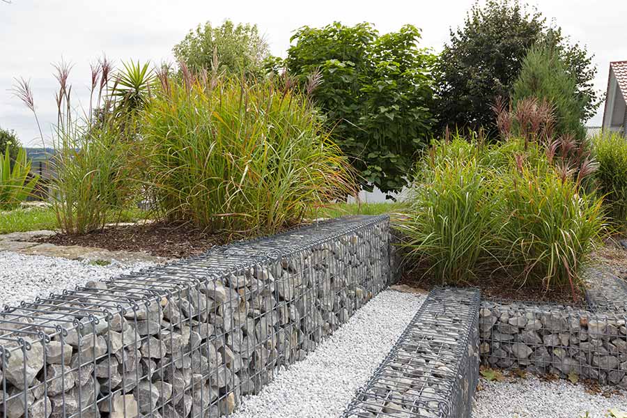 Retaining garden walls built with Gabion cages filled with rock